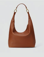 HYER GOODS Hobo Ring Bag in cognac leather, featuring a rounded handle and sleek design, perfect for casual or chic outings.