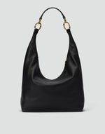 Black and gold Hobo Bag by HYER GOODS featuring a slouchy hobo style with a rounded shape and shoulder strap.