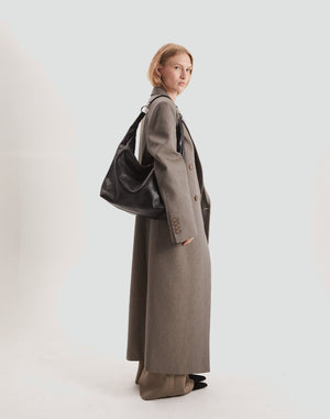 HYER GOODS Hobo Ring Bag in black with silver hardware, stylish hobo bag featuring a ring detail and adjustable strap.