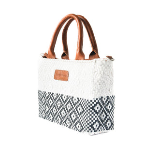 Small Tin Marin woven crossbody bag with white fabric, featuring a compact design and adjustable strap for daily carry.
