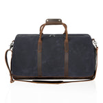 Double Oak Essentials weekender travel bag with leather handles and spacious interior, ideal for short trips and weekend getaways.