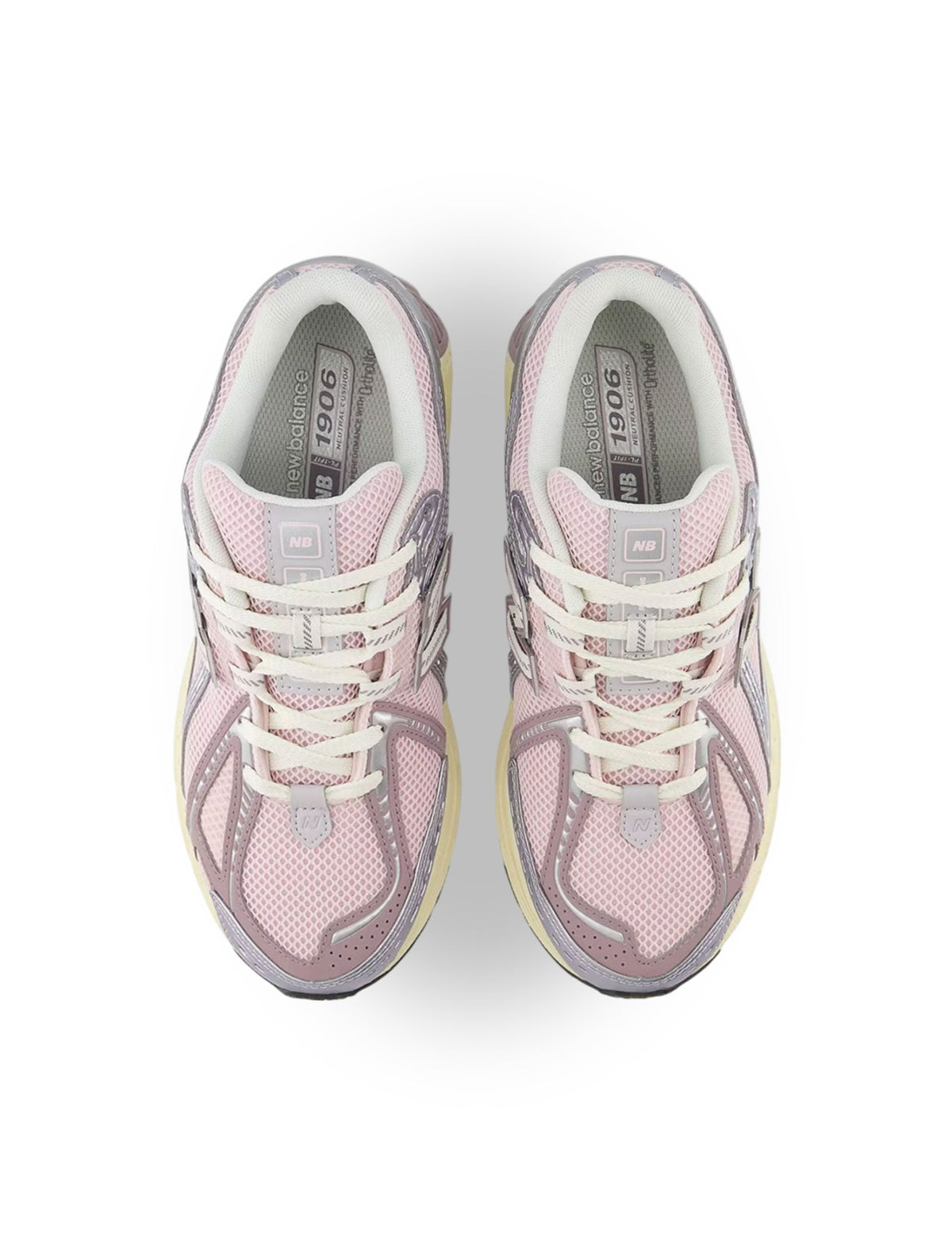 Silver and pink New Balance 1906 women's sneakers with stylish design and comfortable fit, shown on a white background.