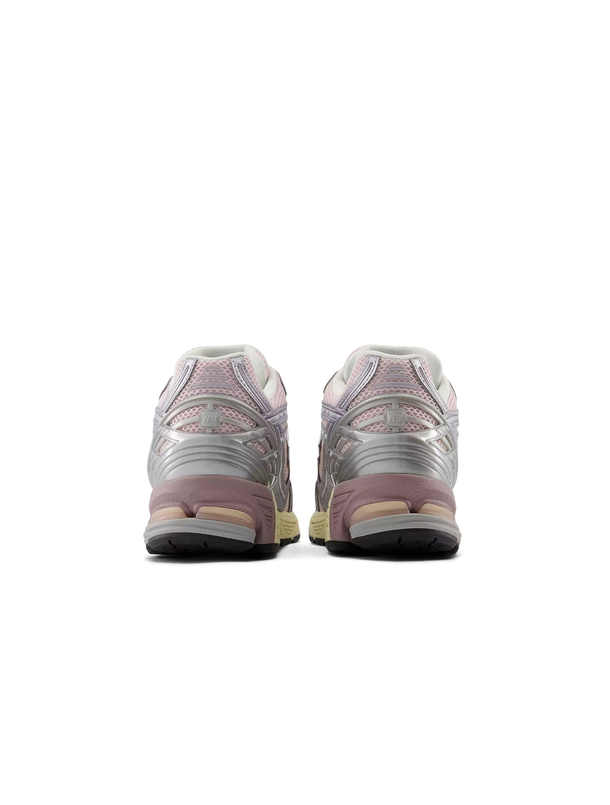 New Balance Women's 1906 Sneakers in silver and pink, stylish athletic footwear with breathable mesh and supportive sole.
