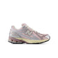 New Balance Women's 1906 Sneakers in silver and pink, stylish athletic footwear with supportive design and trendy color accents.