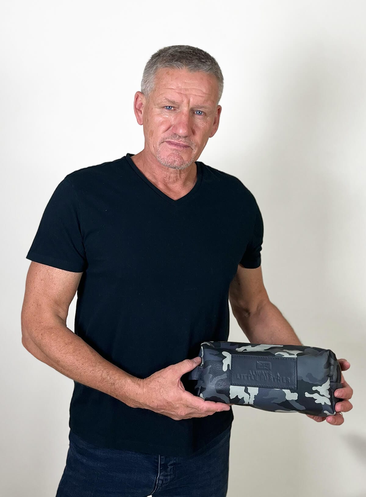 Deux Mains Iron Tight toiletry bag in cargo print with a durable structured design for travel essentials