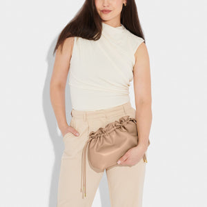 KADOU BOUTIQUE Hailey Crossbody Clutch in soft tan leather, compact design with adjustable strap and stylish finish.