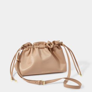 KADOU BOUTIQUE Hailey Crossbody Clutch in soft tan leather, compact design with adjustable strap and sleek finish.