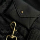 Deux Mains black leather coin pouch in a matching accessories set