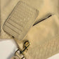 Deux Mains leather key chain in a bone-matching set for accessories and small goods