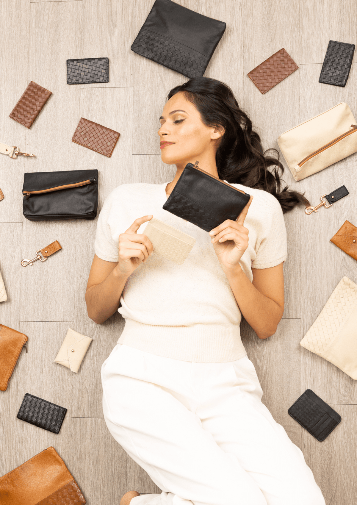 Deux Mains leather coin pouch from the spring collection, shown with accessories model styling