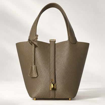 Leather bucket bag with drawstring pouch and mini lock, ComeBackDude leather satchel for everyday use, in etoupe color.