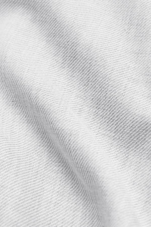 White performance linen shirt by Twillory, featuring lightweight, breathable fabric and a classic fit for casual or professional wear.
