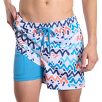 Capelle Miami Line Rush Ocean and Sol Hybrid swim trunks with compression liner and vibrant print design.