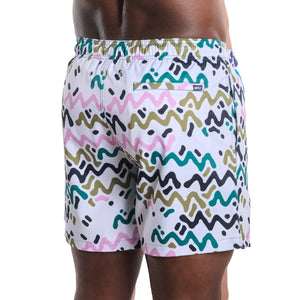 Capelle Miami Line Rush orchid and kelp hybrid print swim trunks with compression lining, back view showing vibrant tropical design.