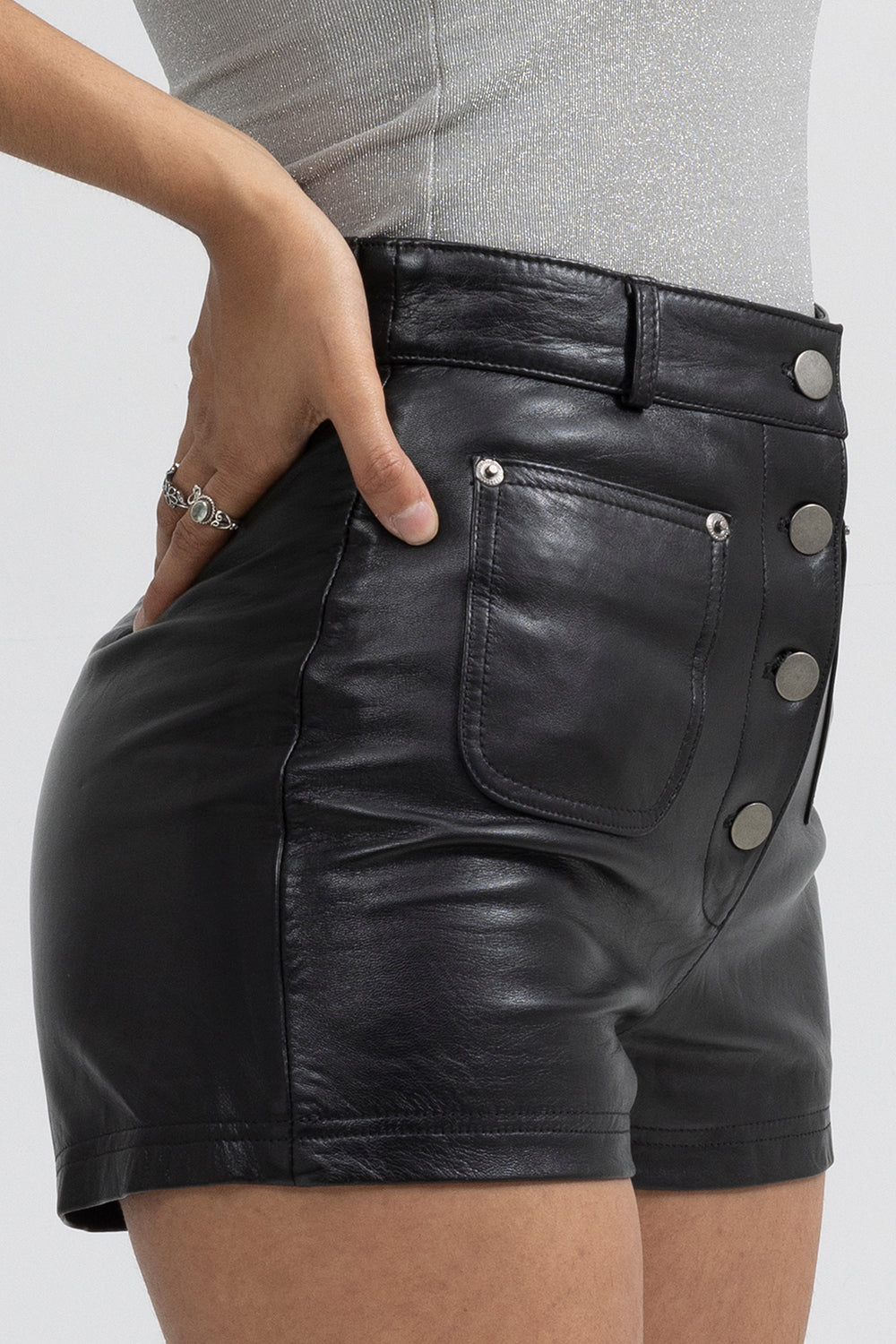 Maleni women's leather shorts by Whet Blu NYC, close-up view of leather texture and tailored details