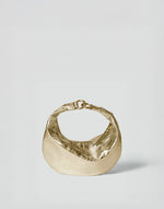 Gold Micro Ring Hobo Bag by HYER GOODS with sleek design and compact shape, featuring a round ring detail and adjustable strap.