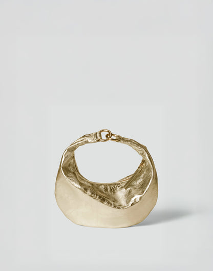 Gold Micro Ring Hobo Bag by HYER GOODS with sleek design and compact shape, featuring a round ring detail and adjustable strap.