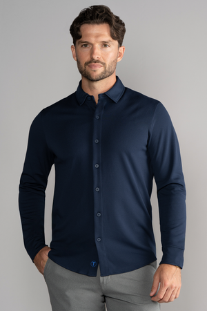 Navy long sleeve button-down polo shirt by Twillory, solid color, with a classic collar and button cuffs, displayed on a hanger.