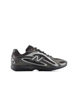 Black New Balance Womens 204L athletic shoes with white accents, showcasing comfortable footwear designed for active women.