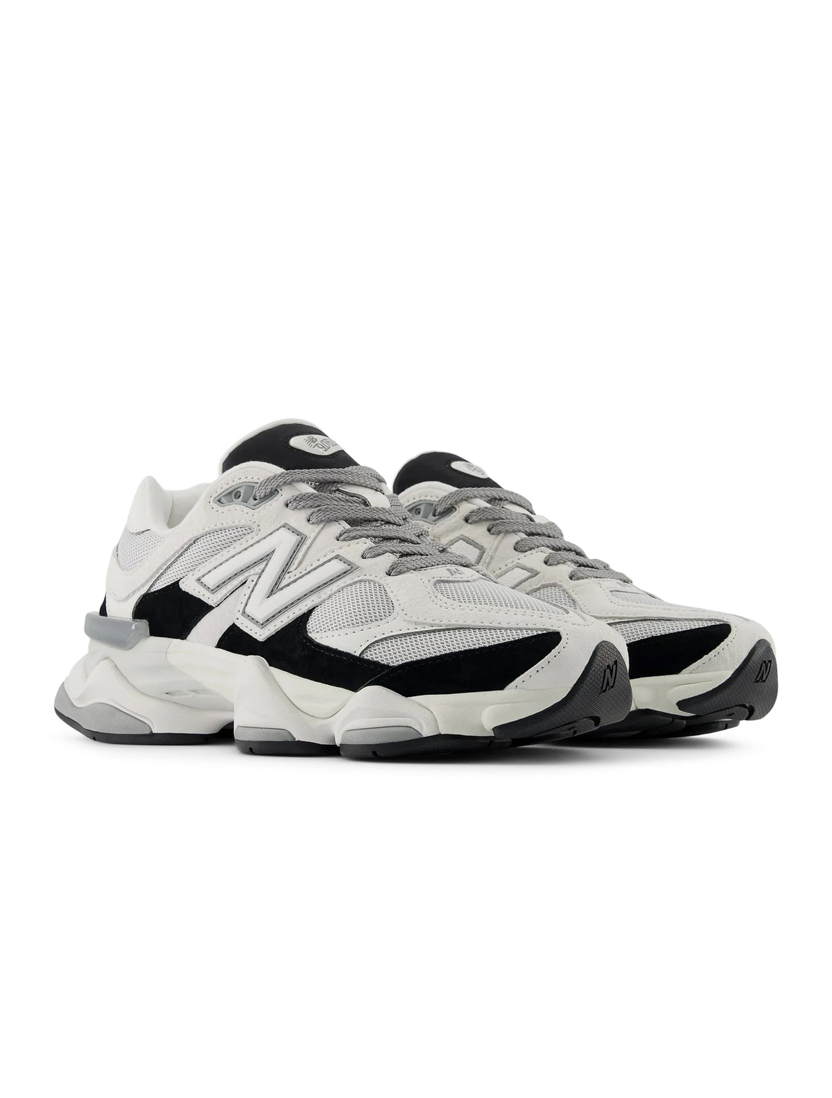 New Balance Men's 9060 lifestyle shoes in white and black, showcasing stylish men's footwear with a modern design.