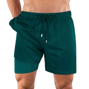 Night green Capelle Miami hybrid swim trunks with compression lining, solid design, suitable for resort and poolside wear.