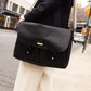 Carry Courage NOMAD messenger bag in coal gray, showing a compact crossbody design with adjustable strap
