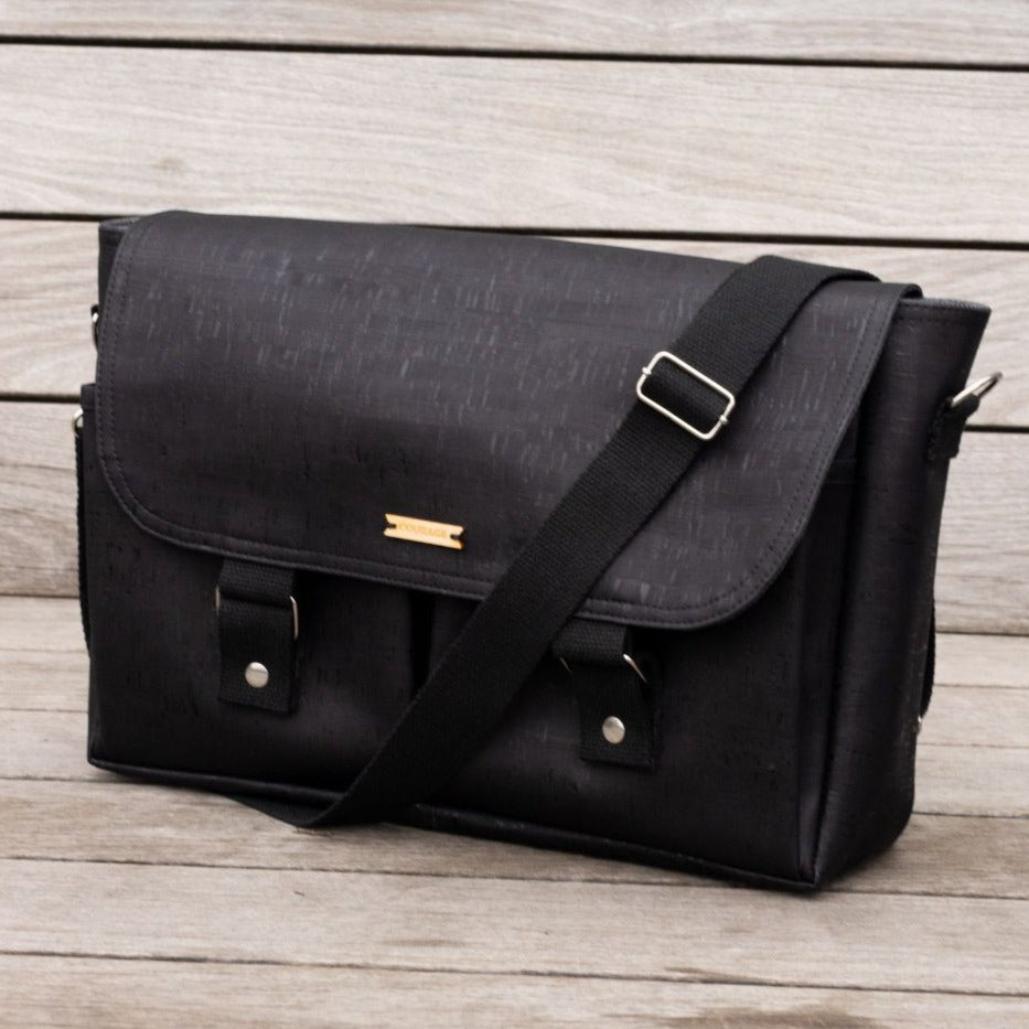 Carry Courage NOMAD messenger bag in coal with black-and-white strap detailing