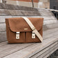 Carry Courage NOMAD SEPIA strap in cream and taupe tones<div>