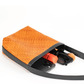 Interior detail of the Deux Mains Panye crossbody bag, showing organized compartments and lining