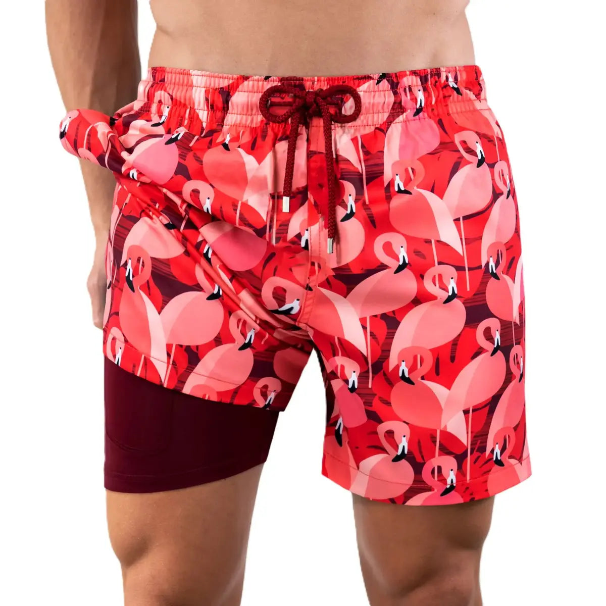 Pink flamingo print Capelle Miami hybrid swim trunks with compression lining, perfect for resort and beach activities.
