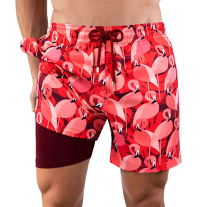 Pink flamingo print Capelle Miami hybrid swim trunks with compression lining, perfect for resort and beach activities.