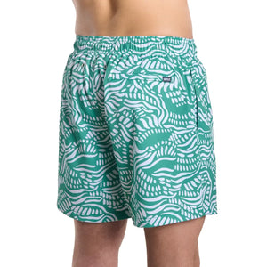 Capelle Miami hybrid salt spray palm and surf print resort trunk with compression lining, back view of stylish swim shorts.