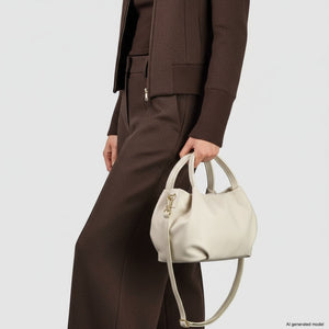 Beige Italian full-grain leather top-handle bag by TAKEASY, featuring a classic design with sturdy top handles and elegant craftsmanship.