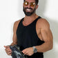 Deux Mains Iron Tight toiletry bag in cargo print, modeled by a laughing person