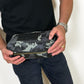 Deux Mains Iron Tight toiletry bag in cargo print, compact accessory pouch with zip closure