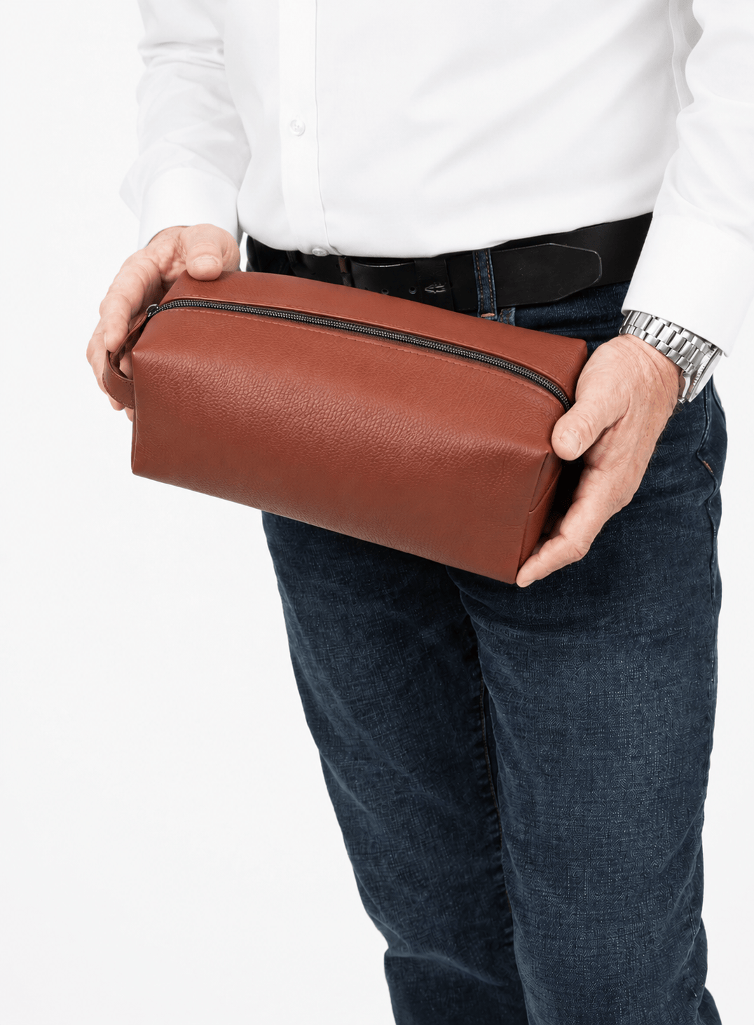 Deux Mains Iron Tight toiletry bag in cognac leather, compact rectangular design with zipper closure