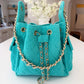 BEACH HAUS Bayshore Bucket Small in turquoise, compact bucket-style bag with structured shape and top handle