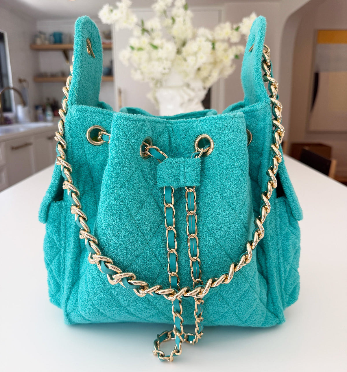 BEACH HAUS Bayshore Bucket Small in turquoise, compact bucket-style bag with structured shape and top handle