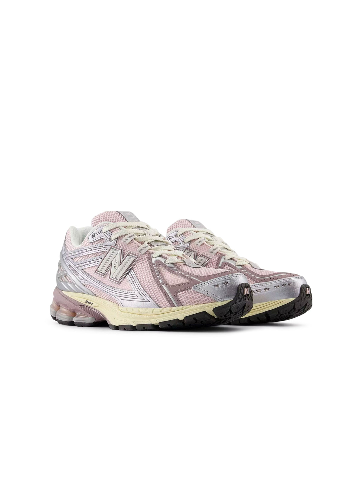 Silver and pink New Balance women's 1906 sneakers with sporty design and breathable mesh uppers.