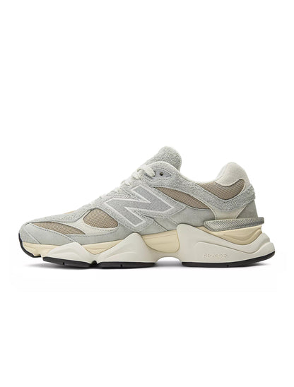 Grey New Balance 9060 men's lifestyle shoes with stylish design and supportive sole, displayed on a clean background.