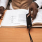 Deux Mains woven bookmark in black, featuring a textured woven design