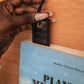 Deux Mains woven bookmark in black with a textured handwoven design