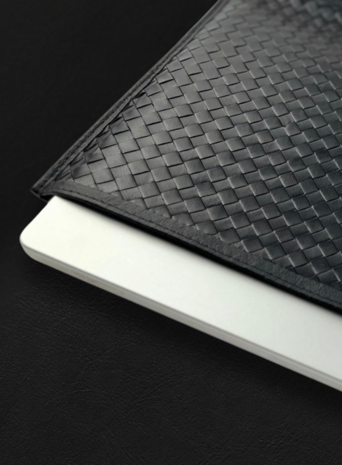 Black woven laptop sleeve by Deux Mains