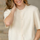 Inherit Co. Zadie ivory short sleeve button-front cardigan layered over a tee
