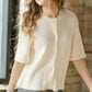 Ivory short sleeve button-front cardigan by Inherit Co. from IC Layering Essentials